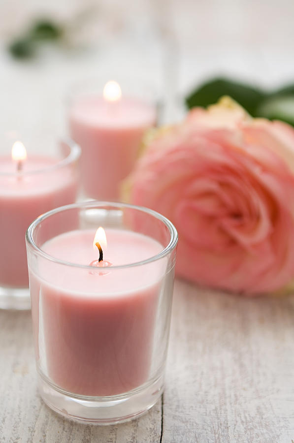 Rose and candles Photograph by Image Source