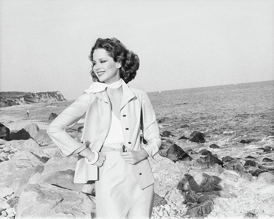 Rosie Vela Wearing A Jacket On A Beach Photograph by Francesco Scavullo