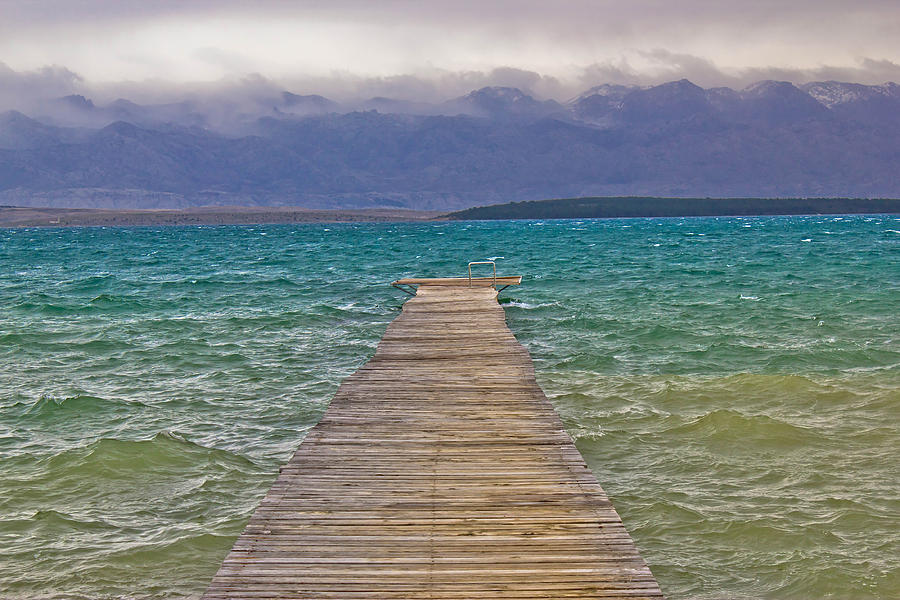 Rough sea and foggy mountain wooden boardwalk Photograph by Brch Photography