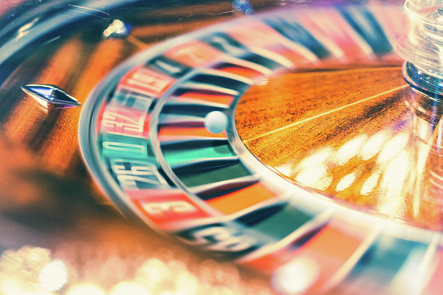 Roulette Wheel In Motion Photograph by Deimagine