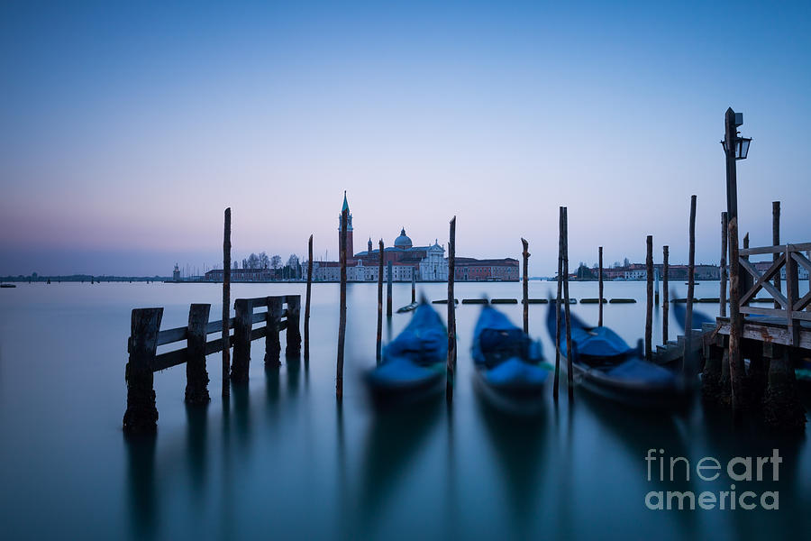 Row of gondolas at sunrise in Venice Italy Photograph by Matteo Colombo