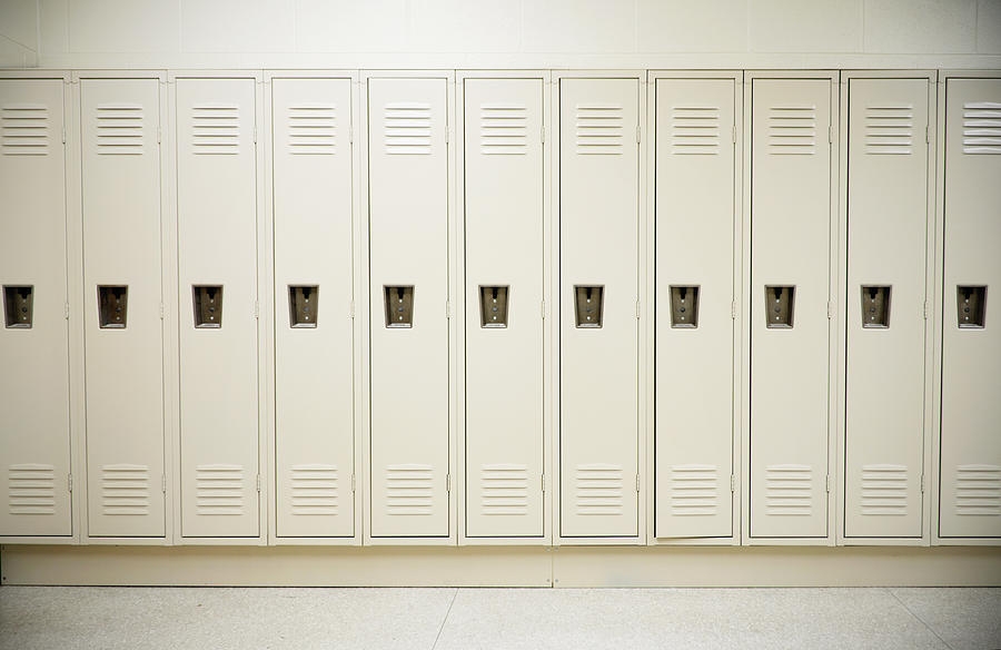 Row of tall white lockers in a white corridor Photograph by Nojustice