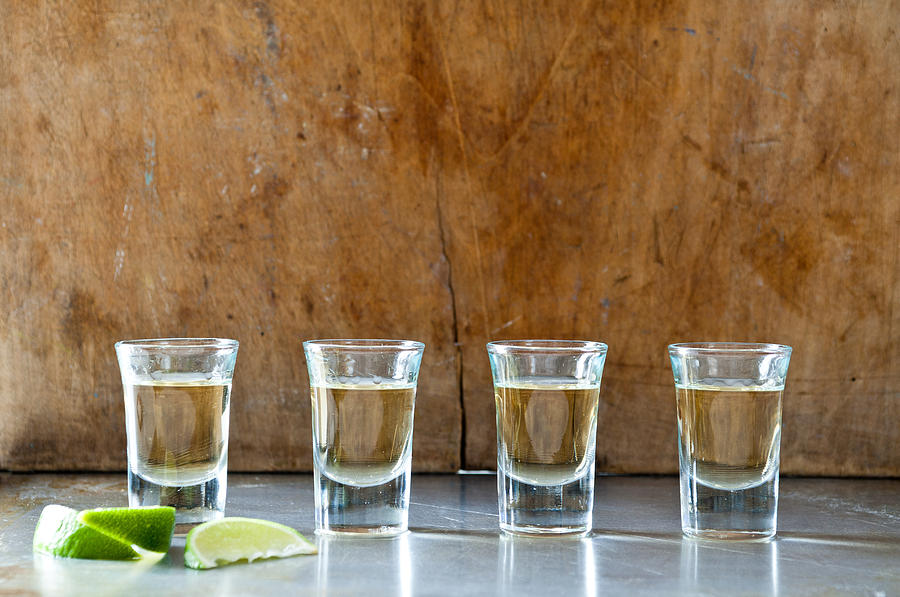 Row of tequila shots Photograph by Image Source