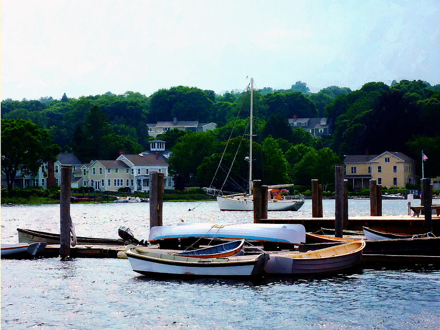 Rowboats Piled at Dock Photograph by Susan Savad