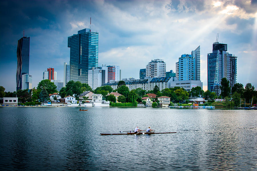 Rowing Boat And The Skyline Of Vienna Photograph by Andreas Berthold