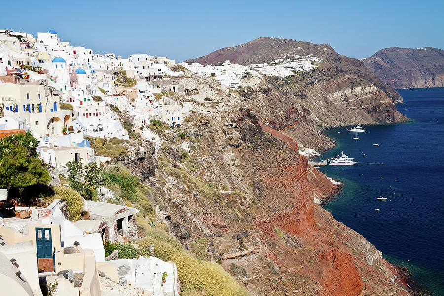 Rows Of Houses Perch On Cliff In Oia Photograph by Melissa Tse