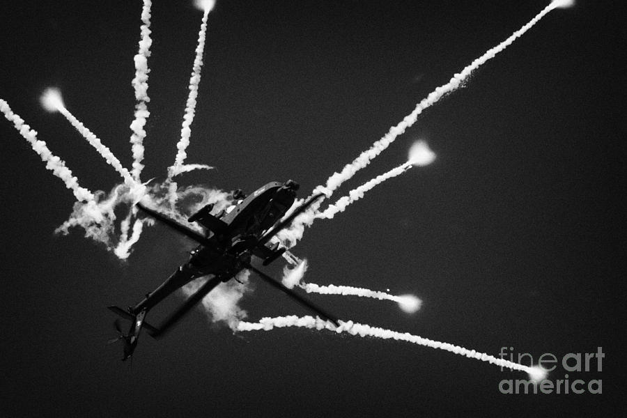 Summer Photograph - Royal Netherlands Air Force Apache AH-64D firing decoy flares by Joe Fox