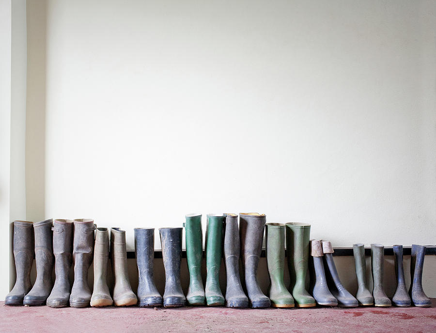 Rubber Boots In A Row Photograph by Ian Nolan
