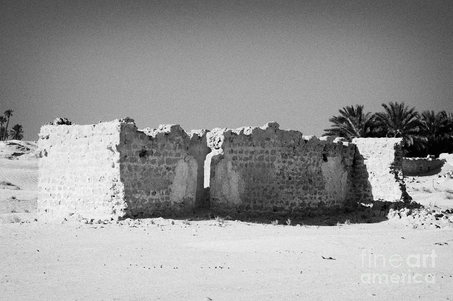 Desert Photograph - ruined abandoned building on the edge of the sahara desert at Douz Tunisia by Joe Fox