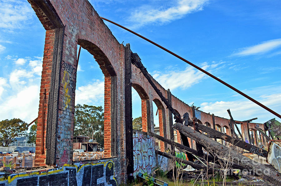 Ruins of the Old Train Roundhouse at Bayshore near San Francisco and the cow Palace Photograph by Jim Fitzpatrick