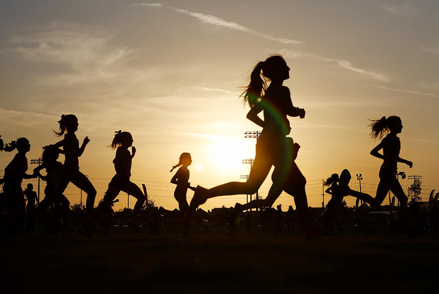 Runners compete in a 5k at sunset in Corona, California. Photograph by K.C. Alfred