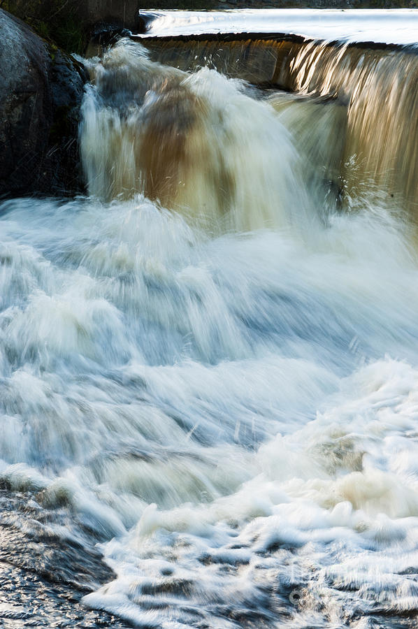 Rushing Water Through Weir Photograph by Peter Noyce