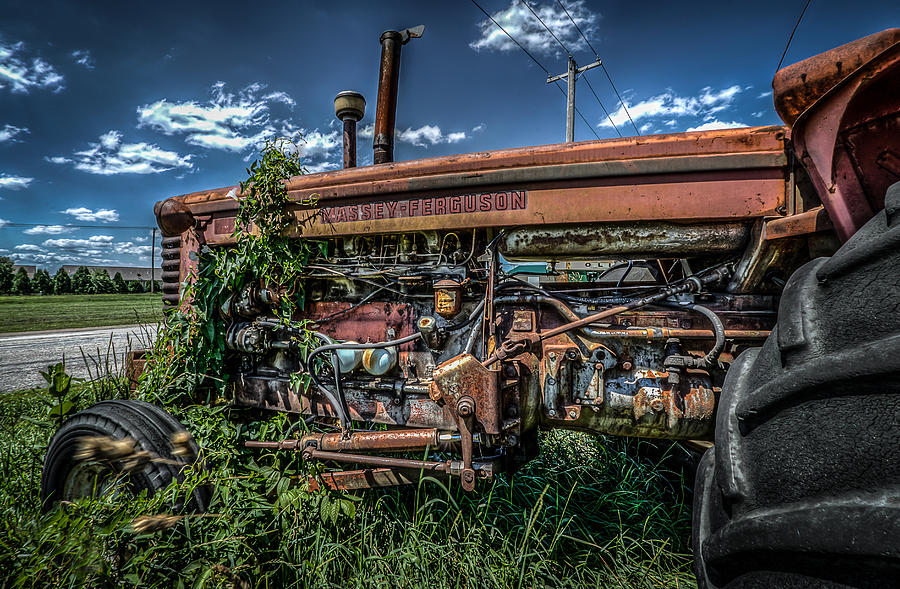 Rusting In The Grass Photograph by Ray Congrove