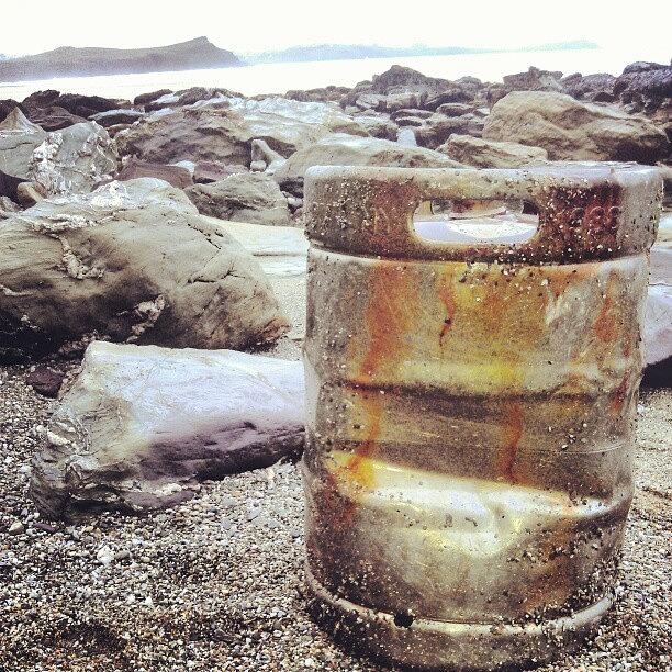 Beach Photograph - Rusty Beach Barrel by Jordan Mounter