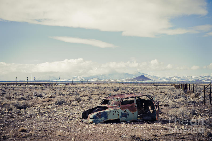 Rusty car in plain Photograph by Scott Sawyer