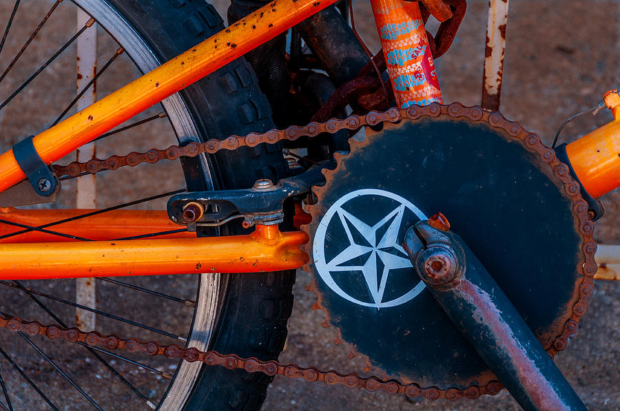 Rusty Chain On Orange Bike Photograph by Xavier Cardell