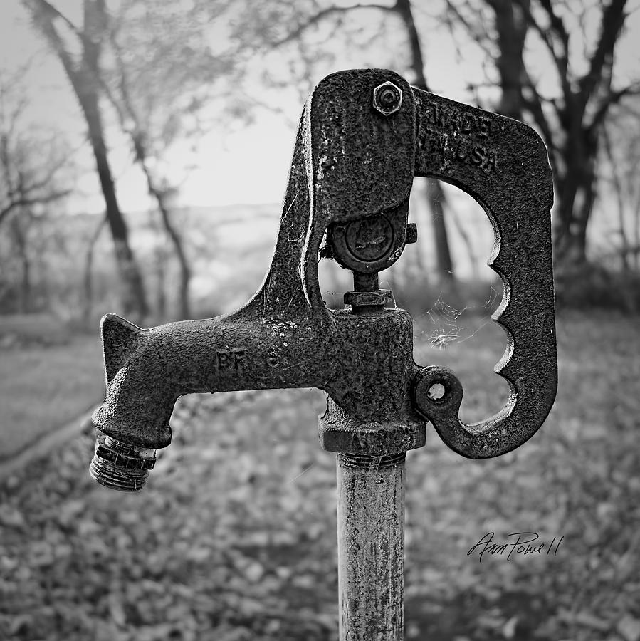 Rusty Metal Water Pump - black and white photograph Photograph by Ann Powell