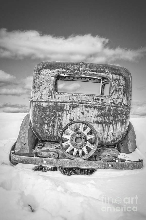 Rusty old car in the snow Photograph by Edward Fielding