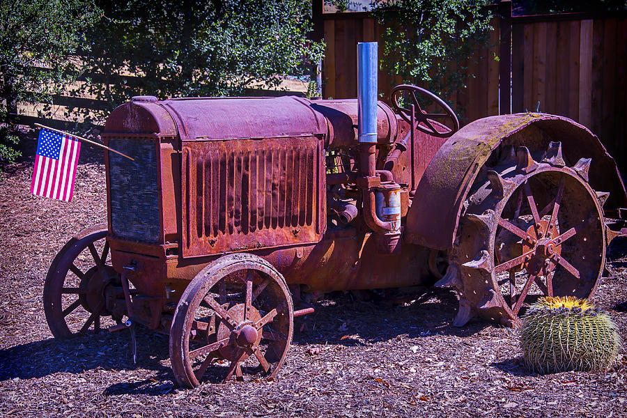 Rusty Tractor With American Flag Photograph by Garry Gay