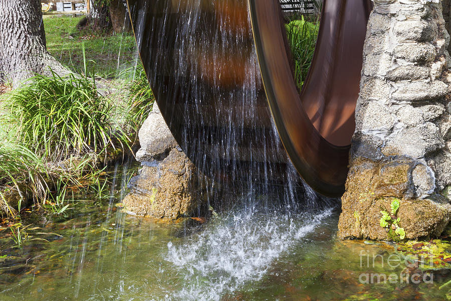 Architecture Photograph - Rusty Water Wheel by Diane Macdonald