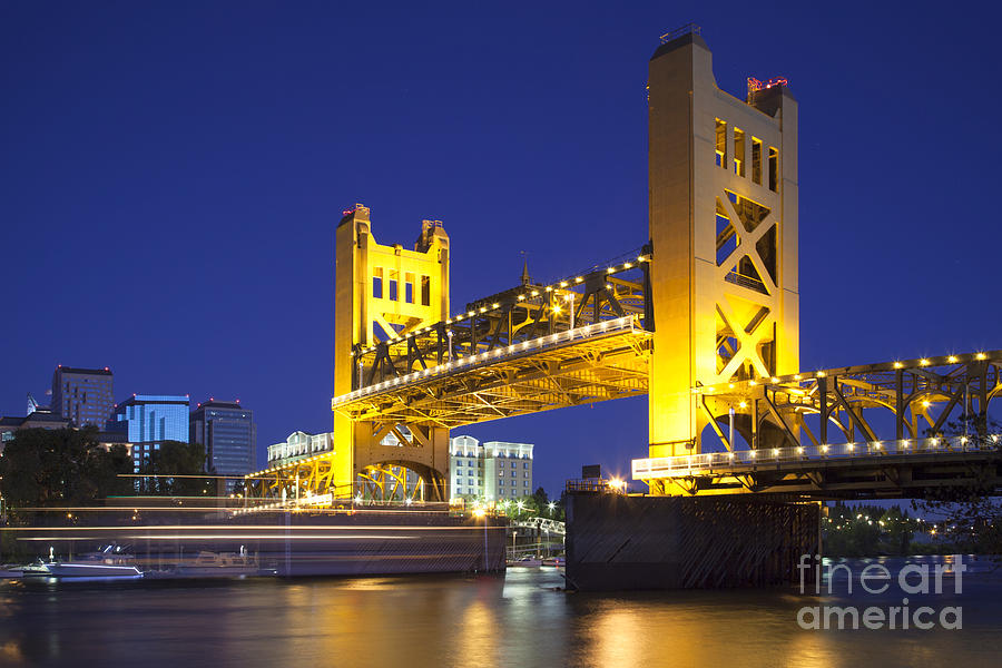 Sacramento River and Tower Bridge raised at dusk Photograph by Ken Brown