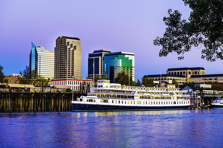 Sacramento skyline and riverfront at dusk Photograph by Dszc