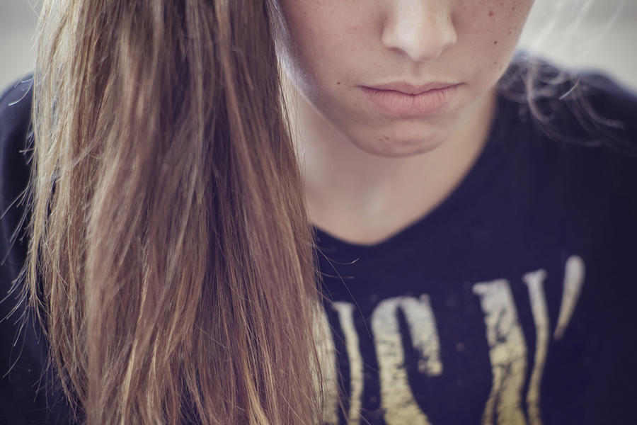 Sad Caucasian teenage girl Photograph by Shestock