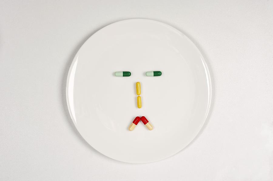 Abstract Photograph - Sad pill face by Science Photo Library