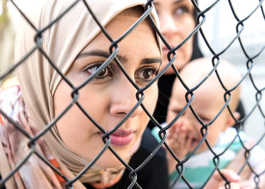 Sad refugee Middle eastern women (Real People) Photograph by Juanmonino