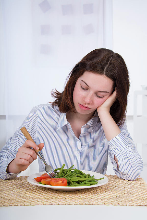 Sad Teenage Girl With Plate Of Vegetables Photograph by Lea Paterson ...