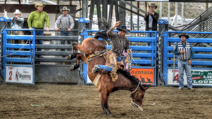 Saddle Bronc Riding in Cody WY Photograph by Paul James Bannerman
