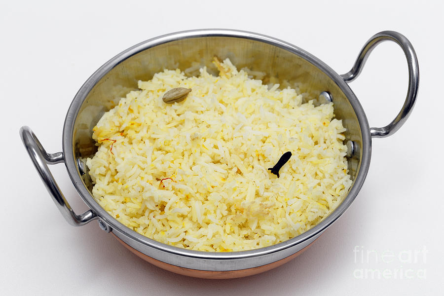 Saffron rice in a kadai bowl Photograph by Paul Cowan