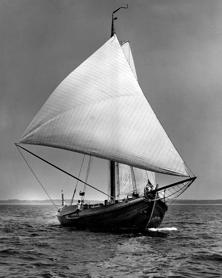 Vintage Photograph - Sailboat coming into view by Retro Images Archive