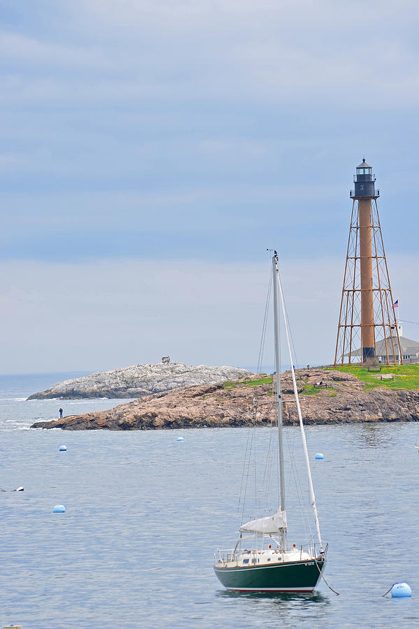 Sailboat in front of Marblehead Light Tower Photograph by Toby McGuire