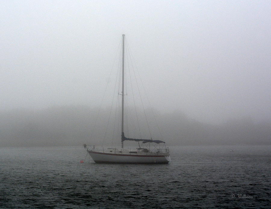 sailboat underway in fog