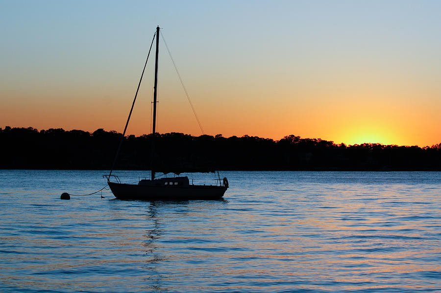 Sunset Photograph - Sailboat Moored at Sunset by Ann Murphy