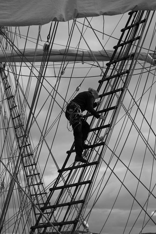 Sailor climbing in the rigging - monochrome Photograph by Ulrich Kunst And Bettina Scheidulin