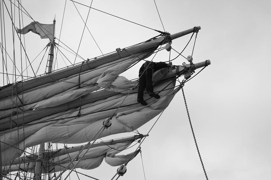 Sailor looseniing sails - monochrome Photograph by Ulrich Kunst And Bettina Scheidulin