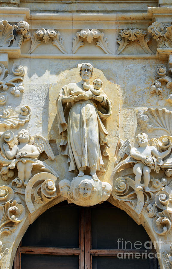 Saint Joseph Holding Baby Jesus above the entrance to Mission San Jose in San Antonio Texas Photograph by Shawn OBrien