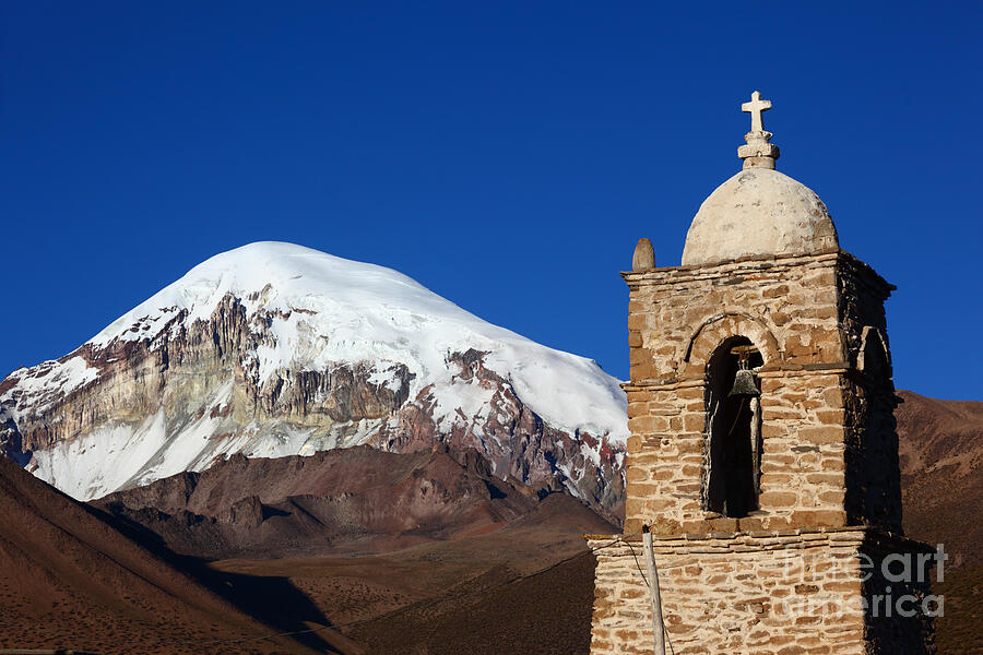 Sajama church tower and volcano Bolivia Photograph by James Brunker