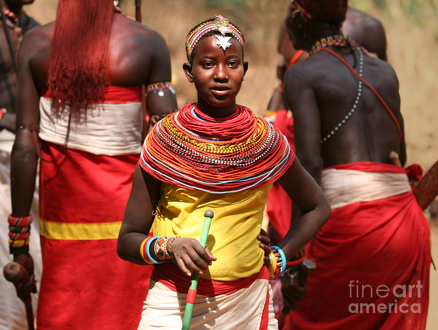 Samburu Photograph - Samburu girl dancing with Warriors by Liz Leyden