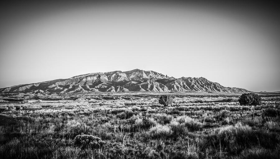 Sandia Mountains in Black and White Photograph by Anthony Doudt