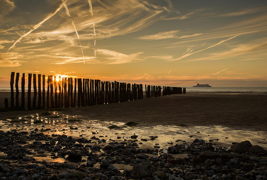 Sangatte beach at sunset Photograph by Ian Middleton