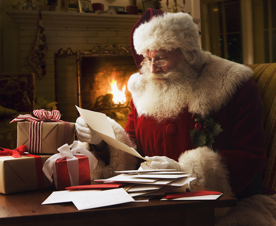 Santa Claus reading letter, close-up Photograph by Jose Luis Pelaez