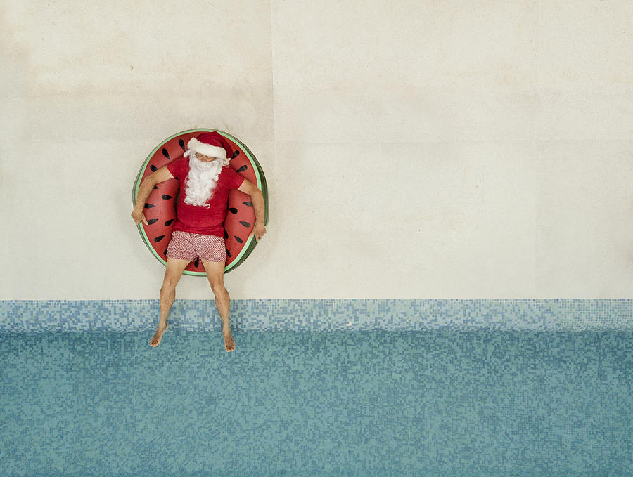 Santa Claus relaxing at the pool Photograph by Orbon Alija