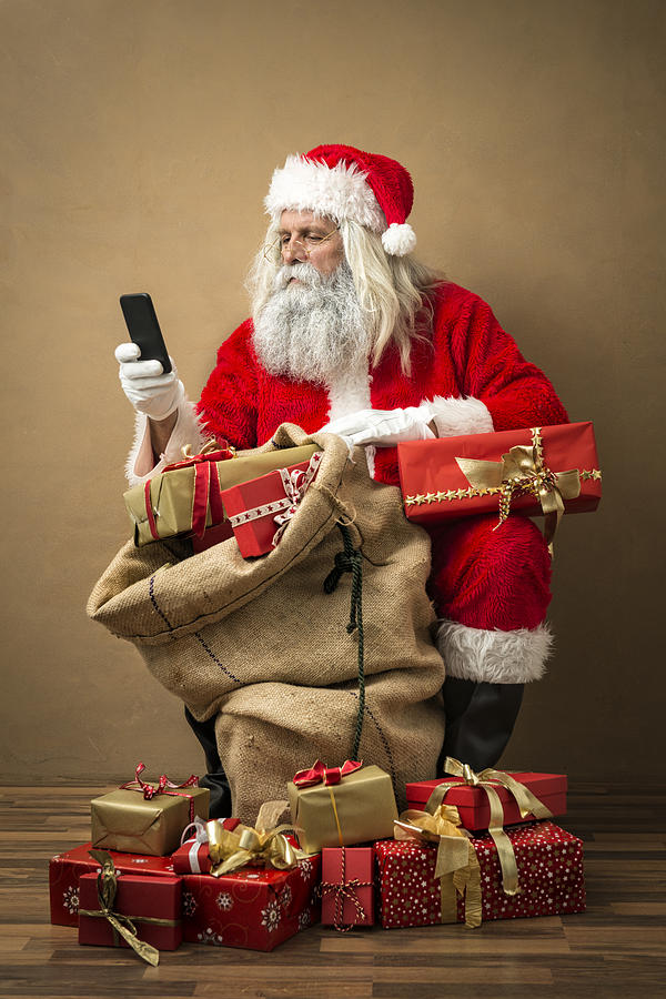 Santa Claus With Many Gifts And A Phone Photograph by Kemter