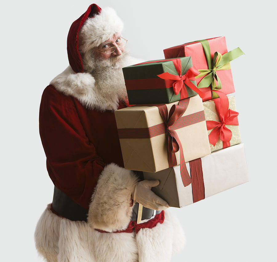 Santa Clause carrying presents, portrait, close-up Photograph by Jose Luis Pelaez