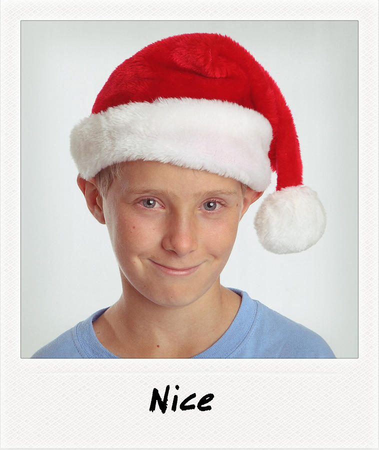 Santa Hat - smiling boy wears santa hat Photograph by Lisa Noble Photography