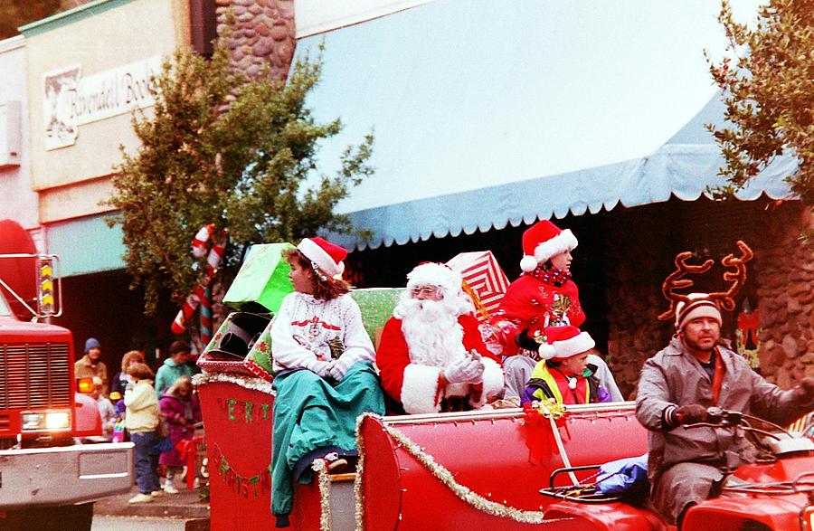 Santa in a parade Photograph by Karl Rose