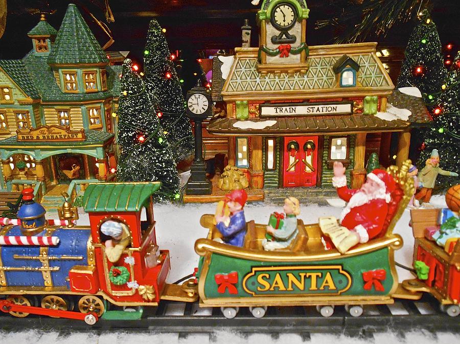 Santa riding a Christmas train Photograph by Joan Reese